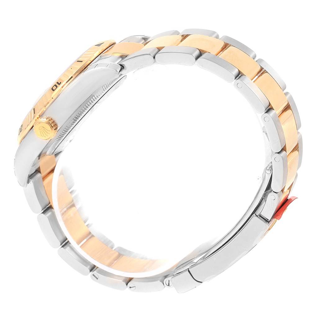 The image shows the side view of a Rolex Turn-o-Graph 116263 Men's Stainless Steel Champagne Dial 116263 Men's Stainless Steel Champagne Dial watch, highlighting its two-tone bracelet and crown.