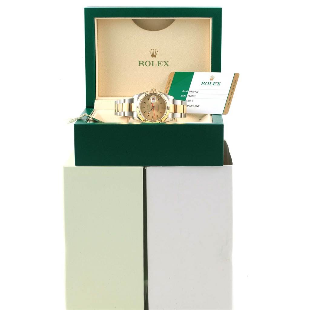 This image shows a Rolex Turn-o-Graph 116263 Men's Stainless Steel Champagne Dial 116263 Men's Stainless Steel Champagne Dial model watch from the front, displayed in its green box with the warranty card.