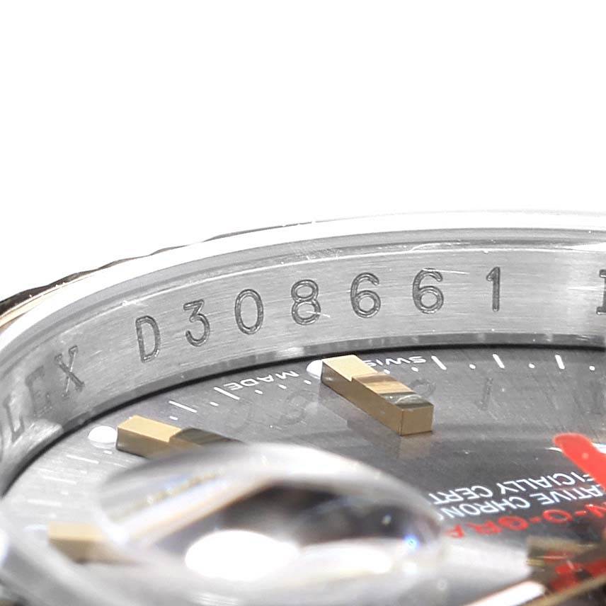 The image shows a partial top view of the Rolex Turn-o-Graph 116263 Men's Steel and Gold (two tone) Grey Dial 116263 Men's Steel and Gold (two tone) Grey Dial, focusing on its serial number, bezel, and dial.