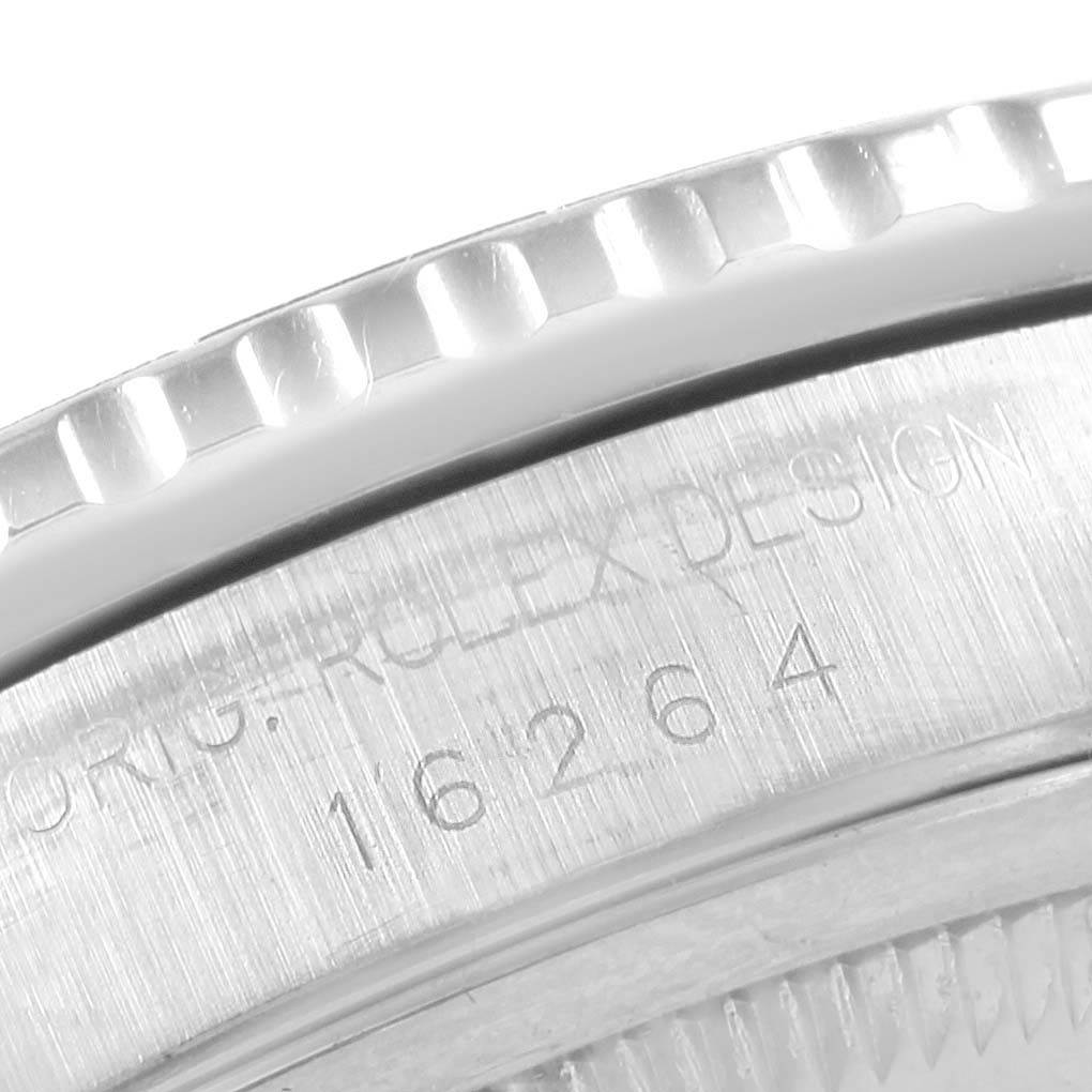 This close-up image shows the bezel and part of the casing with the serial number of a Rolex Turn-o-Graph 16264 Men's Stainless Steel Black Dial 16264 Men's Stainless Steel Black Dial model.