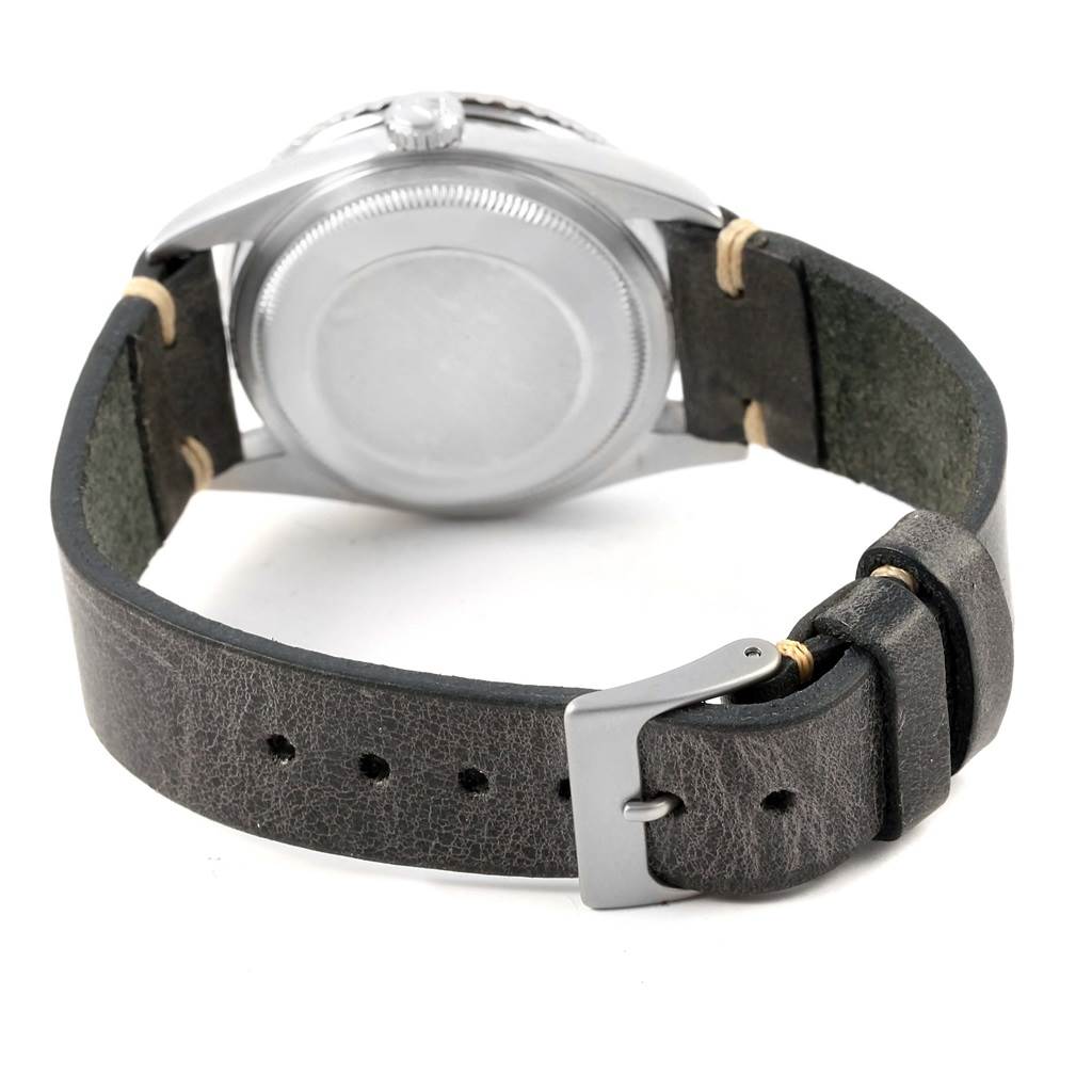 The image shows the back view of a Rolex Turn-o-Graph 16264 Men's Stainless Steel Black Dial 16264 Men's Stainless Steel Black Dial watch, focusing on the case back and leather strap with buckle.