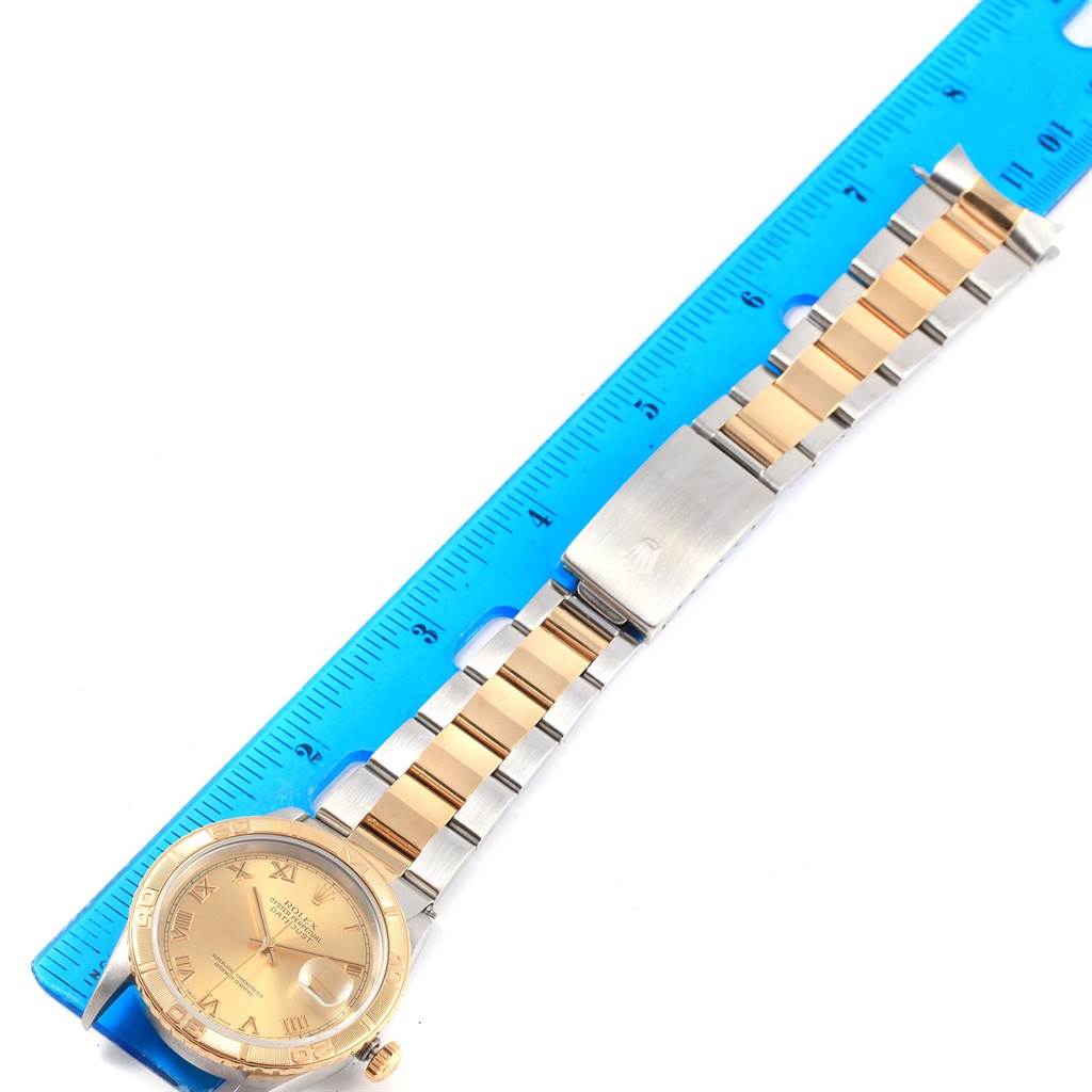 The image shows a Rolex Turn-o-Graph 16263 Men
s Steel and Gold (two tone) Champagne Dial 16263 Men
s Steel and Gold (two tone) Champagne Dial watch photographed from above, including the watch face, bezel, and entire bracelet laid next to a ruler.