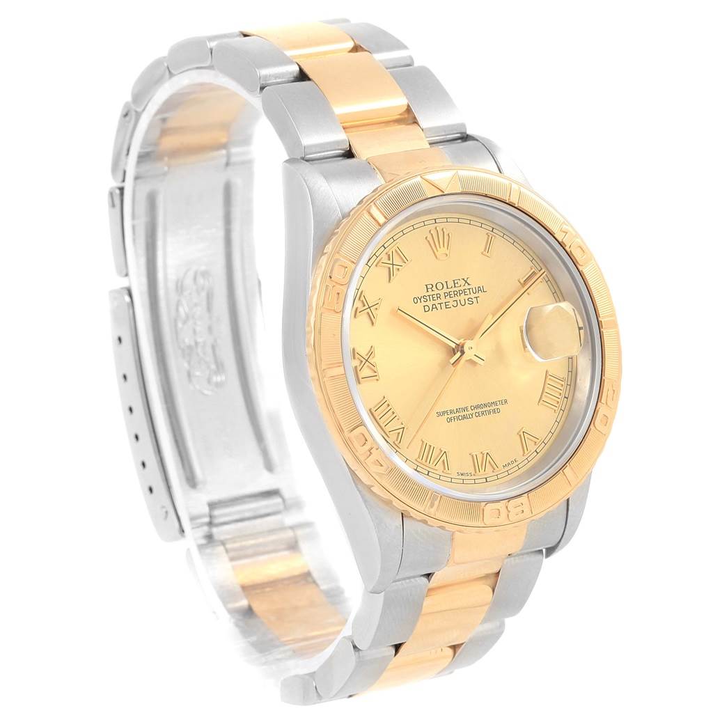 The image shows a side and angled view of a Rolex Turn-o-Graph 16263 Men
s Steel and Gold (two tone) Champagne Dial 16263 Men
s Steel and Gold (two tone) Champagne Dial watch, featuring a two-tone bracelet and a gold dial and bezel.