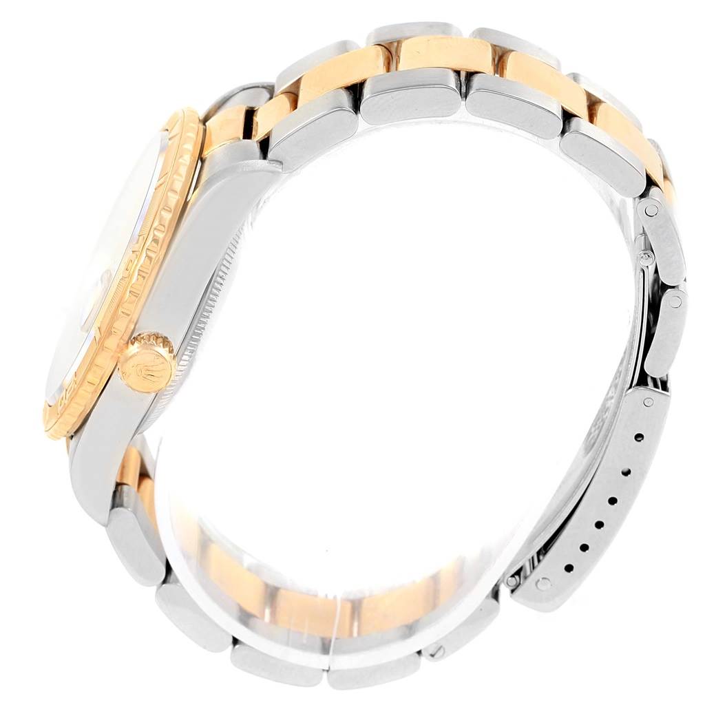 This image shows a side view of a Rolex Turn-o-Graph 16263 Men
s Steel and Gold (two tone) Champagne Dial 16263 Men
s Steel and Gold (two tone) Champagne Dial watch, highlighting its two-tone bracelet and crown.