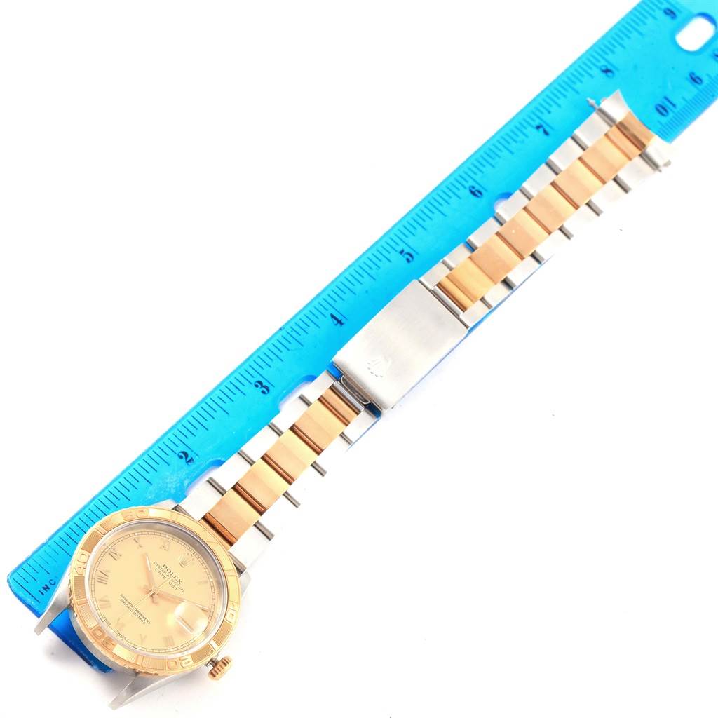 The image shows a Rolex Turn-o-Graph 16263 Men's Steel and Gold (two tone) Champagne Dial 16263 Men's Steel and Gold (two tone) Champagne Dial watch model laid flat with its bracelet alongside a blue ruler for scale.