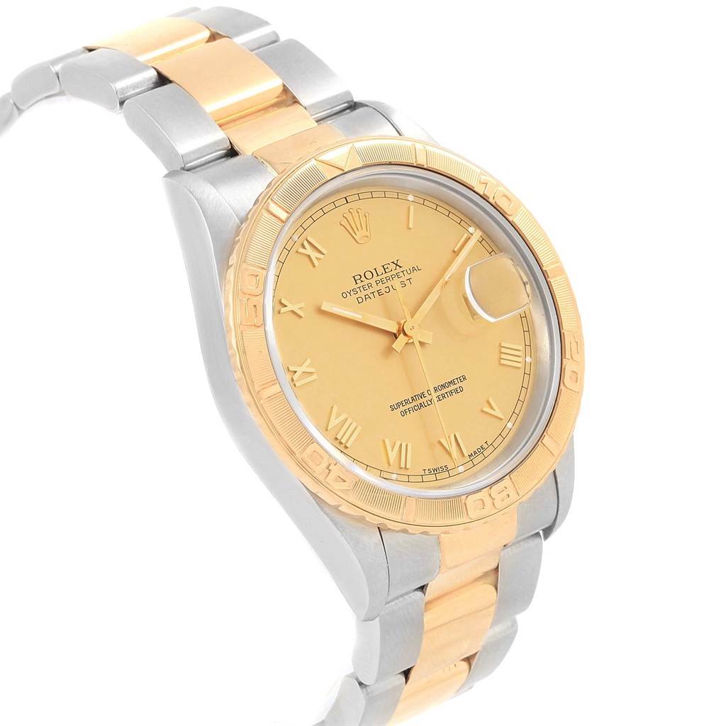 This image shows a Rolex Turn-o-Graph 16263 Men's Steel and Gold (two tone) Champagne Dial 16263 Men's Steel and Gold (two tone) Champagne Dial watch at an angle, highlighting its gold bezel, gold dial, and two-tone metal bracelet.