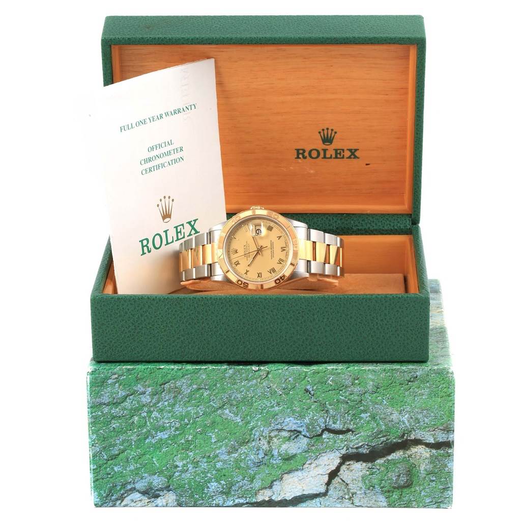 The Rolex Turn-o-Graph 16263 Men's Steel and Gold (two tone) Champagne Dial 16263 Men's Steel and Gold (two tone) Champagne Dial watch is shown in its box, front view, with warranty and certification documents.