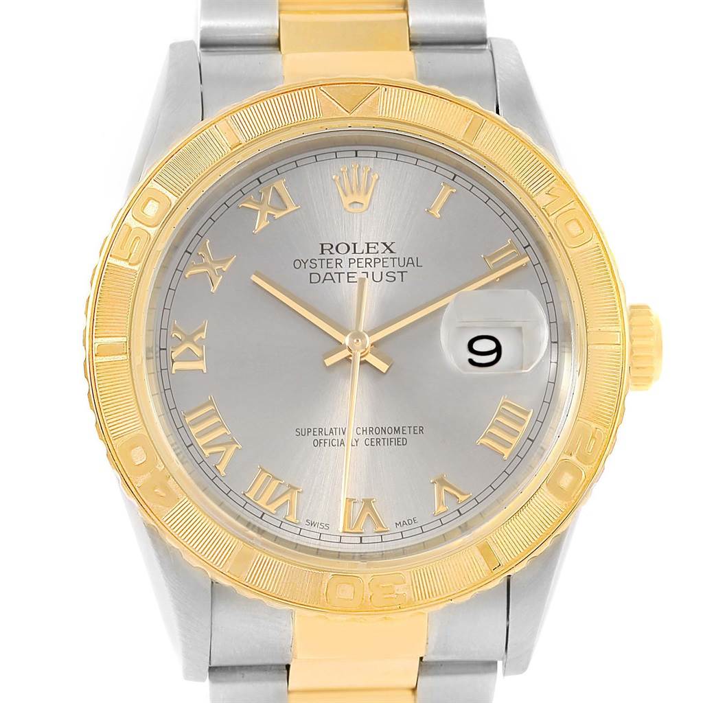This image shows the front face of a Rolex Turn-o-Graph 16263 Men's Steel and Gold (two tone) Grey Dial 16263 Men's Steel and Gold (two tone) Grey Dial with gold bezel, hour markers, and a date magnifier.