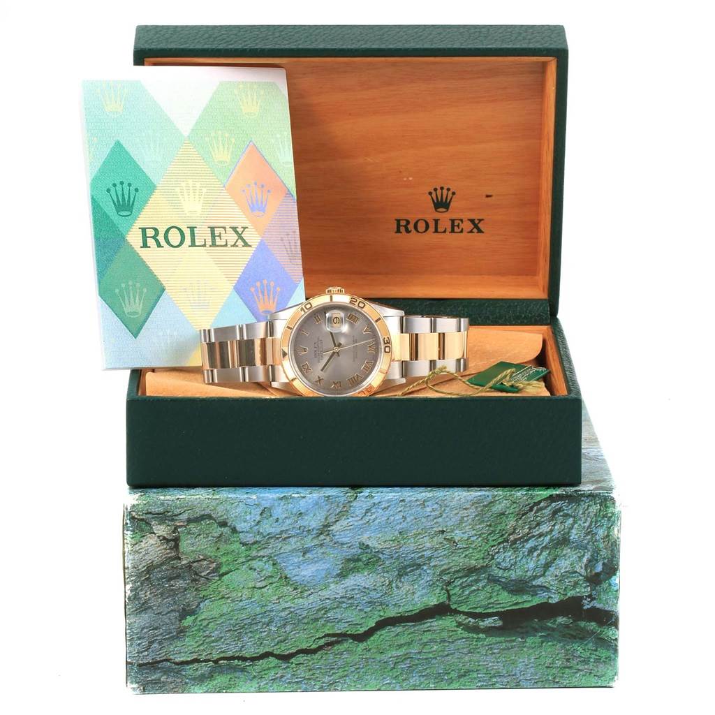 The image shows a Rolex Turn-o-Graph 16263 Men's Steel and Gold (two tone) Grey Dial 16263 Men's Steel and Gold (two tone) Grey Dial watch placed inside an open green and wood Rolex box along with its booklet.