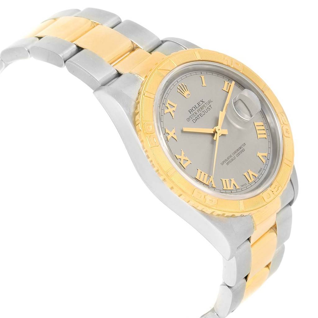 The image shows a side view of a Rolex Turn-o-Graph 16263 Men's Steel and Gold (two tone) Grey Dial 16263 Men's Steel and Gold (two tone) Grey Dial watch, highlighting the gold and silver bracelet, bezel, and dial with Roman numerals.