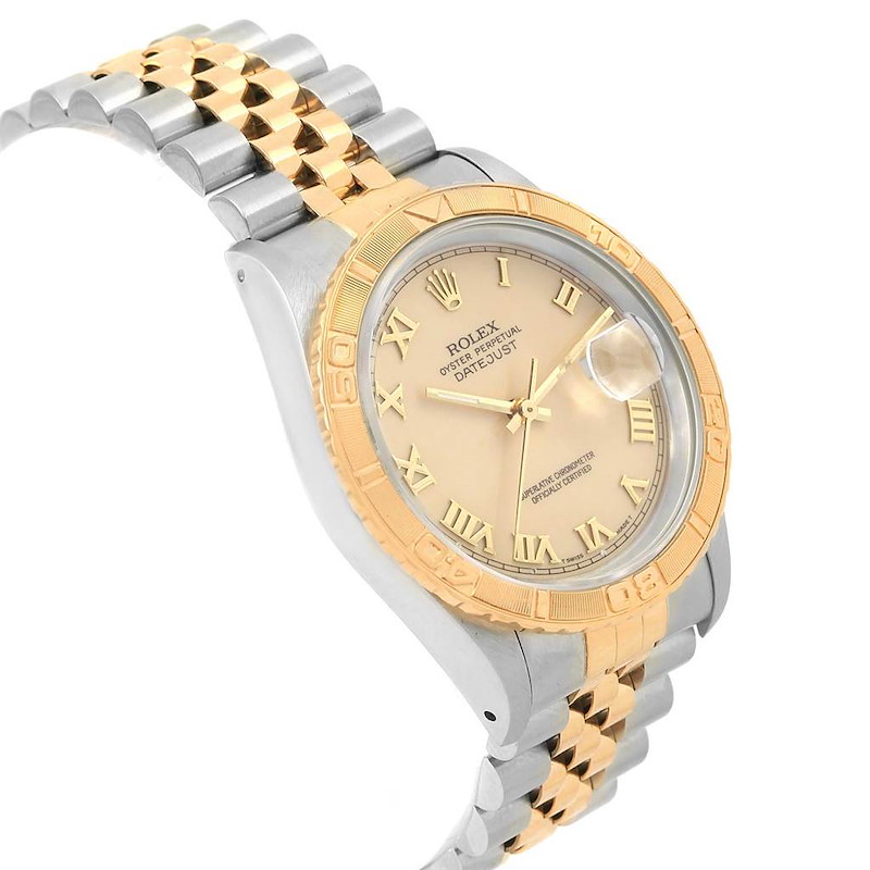 The image shows a Rolex Turn-o-Graph watch angled from the right, highlighting its dial, bezel, and two-tone bracelet.