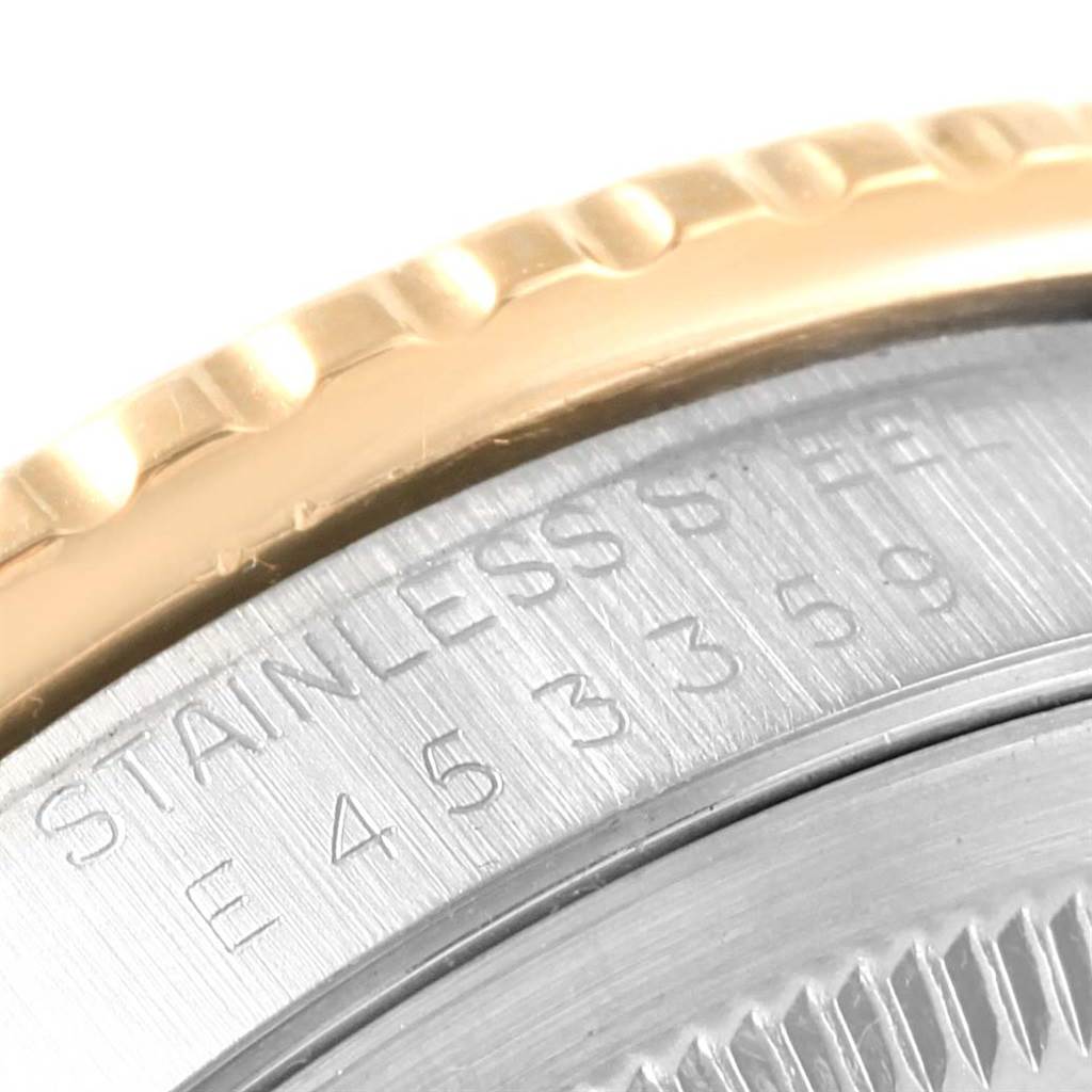 Close-up of the edge of a Rolex Turn-o-Graph 16263 Men
s Steel and Gold (two tone) Beige Dial 16263 Men
s Steel and Gold (two tone) Beige Dial showing part of the bezel and engraved serial number.