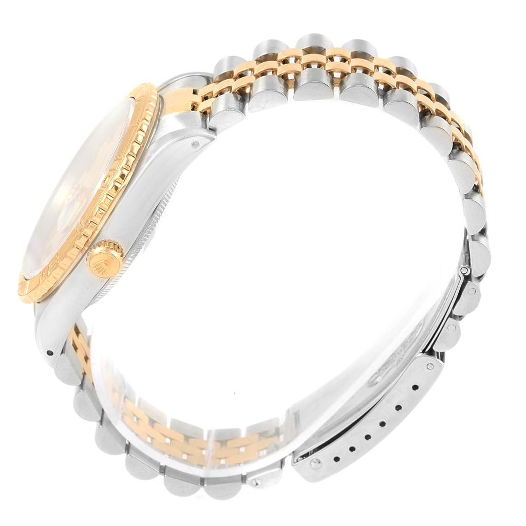 The image shows the side view of a Rolex Turn-o-Graph 16263 Men
s Steel and Gold (two tone) Beige Dial 16263 Men
s Steel and Gold (two tone) Beige Dial, highlighting the case, crown, bezel, and two-tone bracelet.