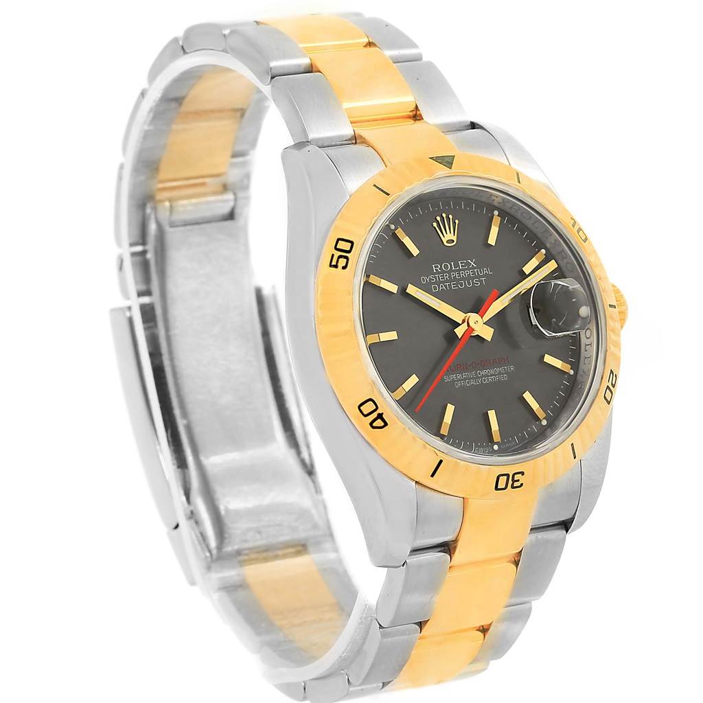 The image shows a three-quarter view of a Rolex Turn-o-Graph 116263 Men
s Steel and Gold (two tone) Grey Dial 116263 Men
s Steel and Gold (two tone) Grey Dial watch, displaying its gold bezel, black dial, and two-tone metal bracelet.