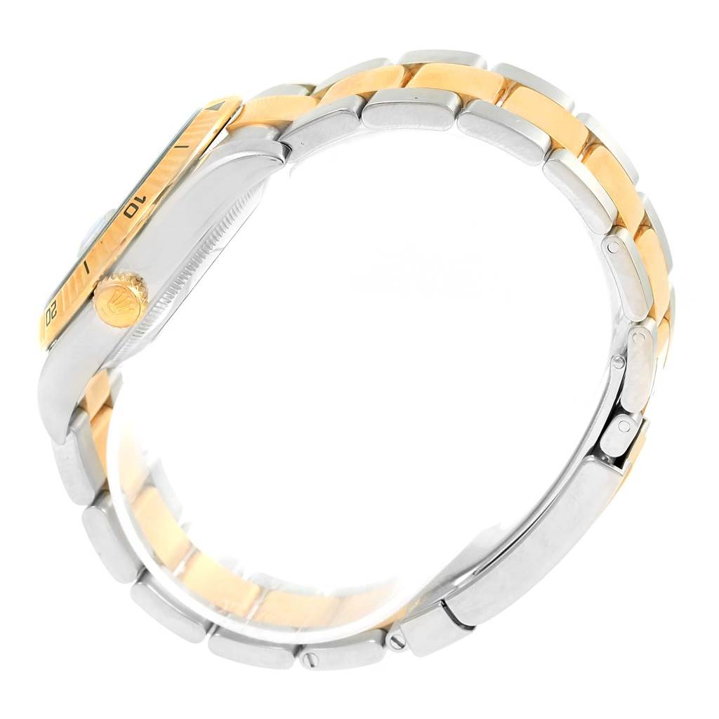 This image shows a side view of a Rolex Turn-o-Graph 116263 Men
s Steel and Gold (two tone) Grey Dial 116263 Men
s Steel and Gold (two tone) Grey Dial watch highlighting the bezel, crown, and two-tone bracelet.