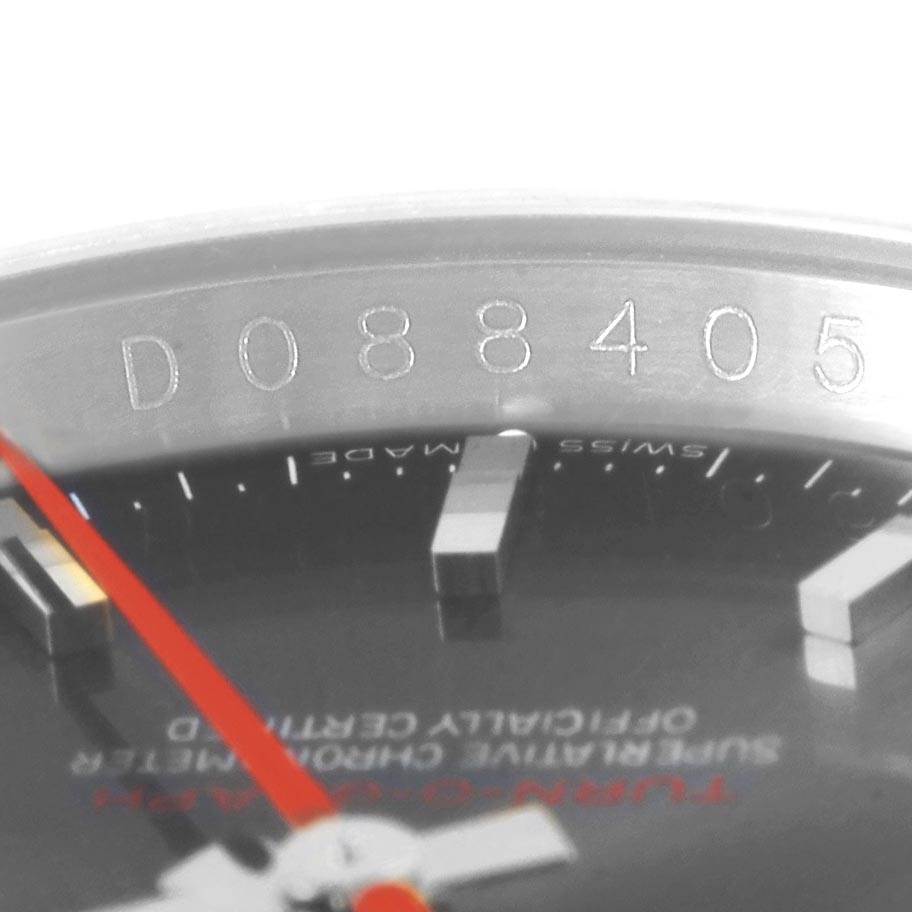 This close-up angle of the Rolex Turn-o-Graph 116263 Men's Steel and Gold (two tone) Grey Dial 116263 Men's Steel and Gold (two tone) Grey Dial shows the bezel with serial number and part of the dial with red second hand.