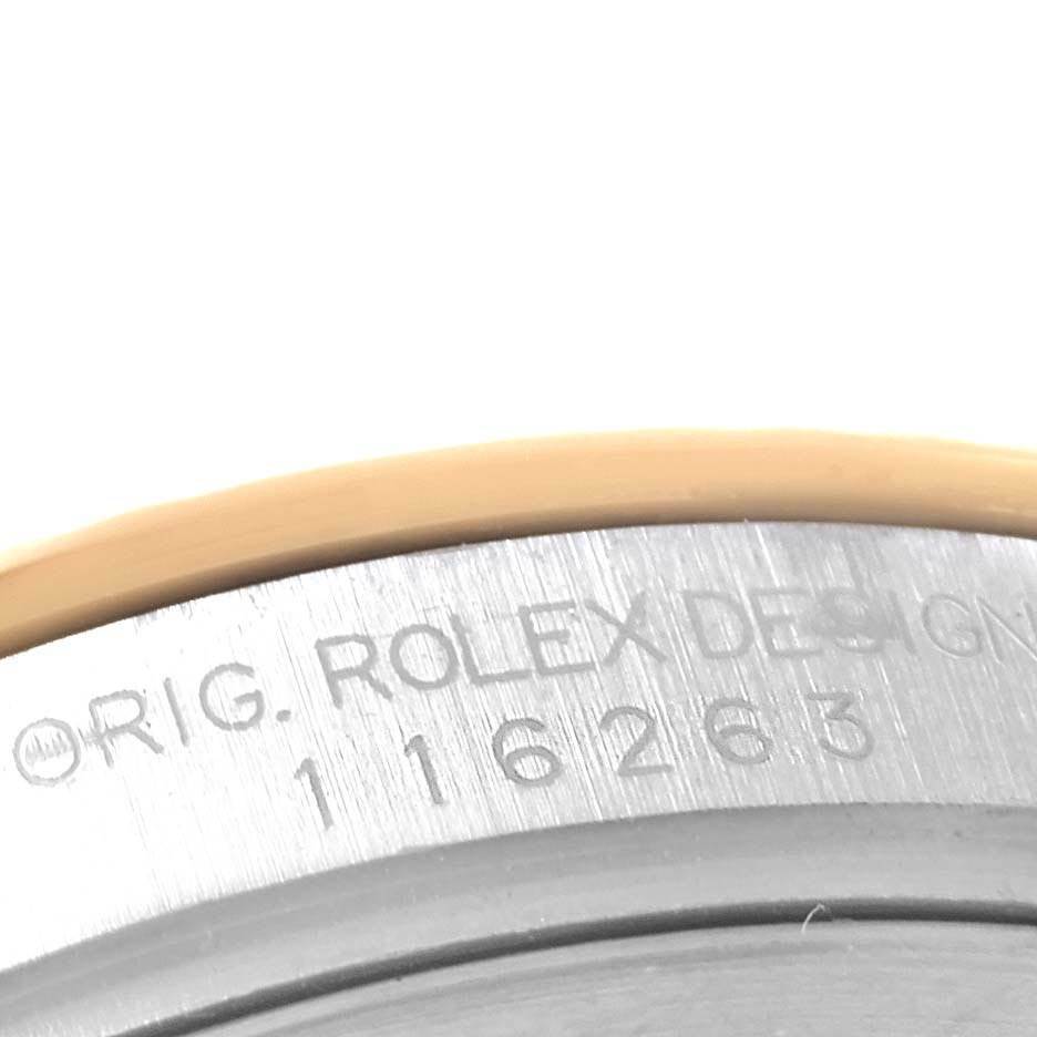 This image shows a close-up of the model and serial numbers engraved on the side of a Rolex Turn-o-Graph 116263 Men's Steel and Gold (two tone) Grey Dial 116263 Men's Steel and Gold (two tone) Grey Dial watch.