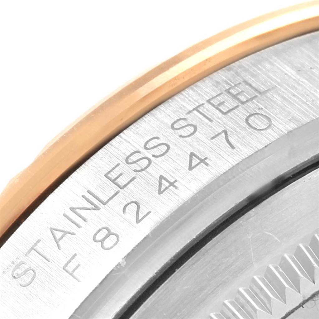 This close-up shows the stainless steel bezel of the Rolex Turn-o-Graph 116261 Men's Stainless Steel Black Dial 116261 Men's Stainless Steel Black Dial, with part of the serial number visible.