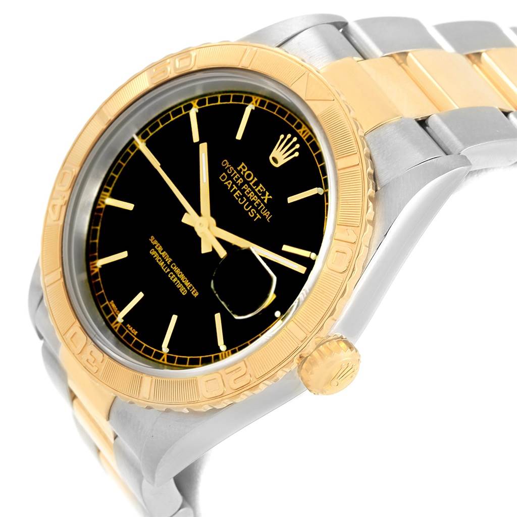 The image shows a side angle of a Rolex Turn-o-Graph 16263 Men's Steel and Gold (two tone) Black Dial 16263 Men's Steel and Gold (two tone) Black Dial watch, featuring its black dial, gold bezel, and two-tone bracelet.