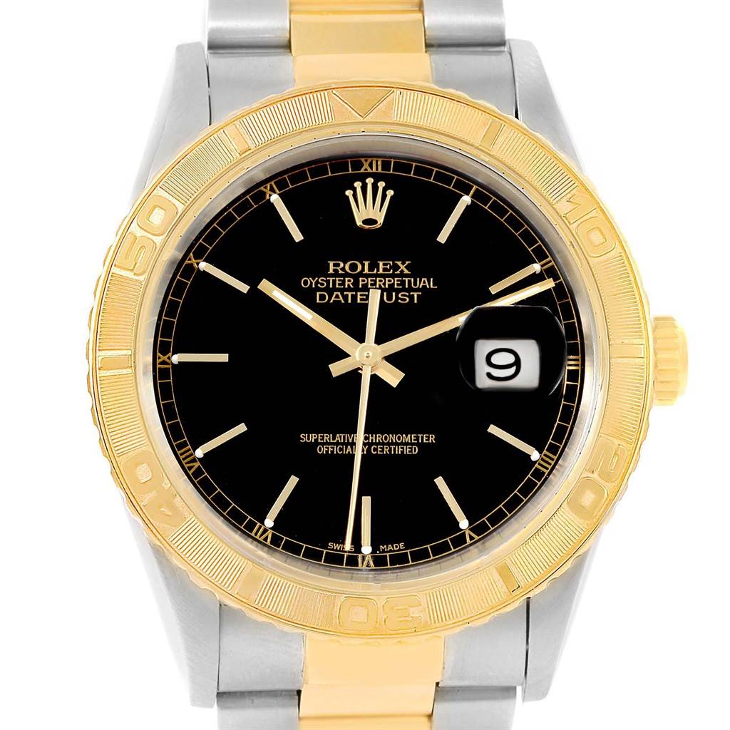 The image shows a front view of the Rolex Turn-o-Graph 16263 Men's Steel and Gold (two tone) Black Dial 16263 Men's Steel and Gold (two tone) Black Dial watch, highlighting its gold bezel, black dial, and date window.