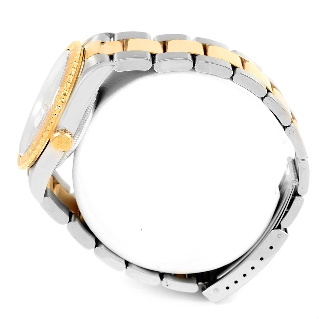 This image shows a side view of a Rolex Turn-o-Graph 16263 Men's Steel and Gold (two tone) Black Dial 16263 Men's Steel and Gold (two tone) Black Dial model watch, highlighting its bezel and two-tone metal bracelet.