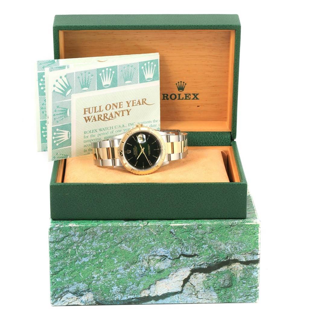 The image shows a Rolex Turn-o-Graph 16263 Men's Steel and Gold (two tone) Black Dial 16263 Men's Steel and Gold (two tone) Black Dial watch in an open green box, accompanied by warranty cards.