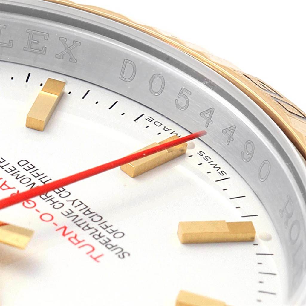This image shows a close-up of the Rolex Turn-o-Graph 116263 Men
s Stainless Steel White Dial 116263 Men
s Stainless Steel White Dial watch dial, highlighting the markers, red second hand, and part of the bezel.