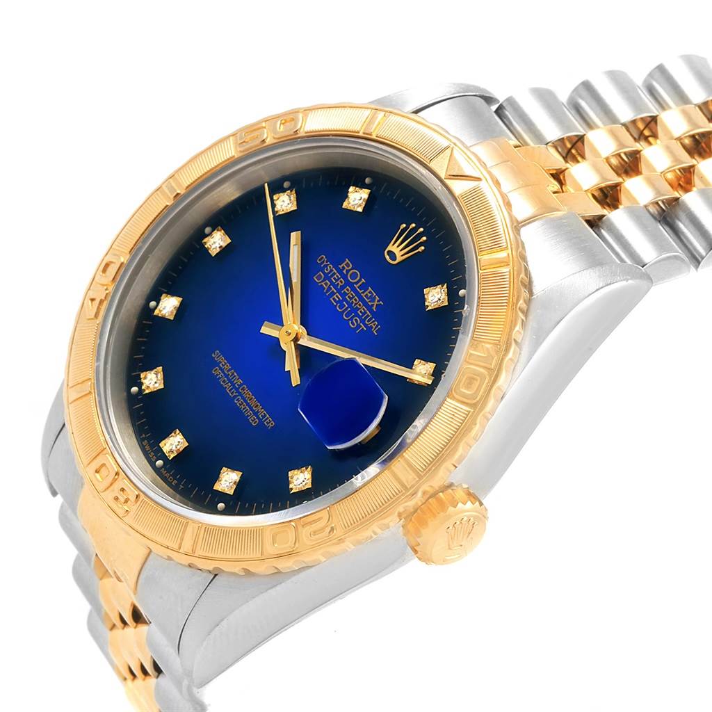 This image shows a Rolex Turn-o-Graph 16263 Men
s Steel and Gold (two tone) Blue Dial 16263 Men
s Steel and Gold (two tone) Blue Dial watch at an angled view, highlighting the blue dial, gold bezel, crown, and two-tone bracelet.