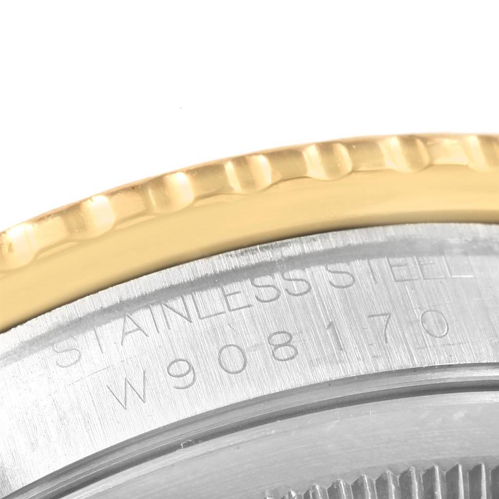 This close-up image shows the engraved stainless steel back cover and gold bezel of a Rolex Turn-o-Graph 16263 Men
s Steel and Gold (two tone) Blue Dial 16263 Men
s Steel and Gold (two tone) Blue Dial watch.