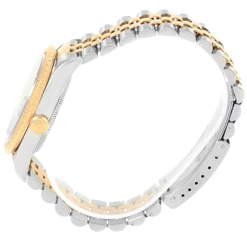 This image shows a side view of the Rolex Turn-o-Graph 16263 Men
s Steel and Gold (two tone) Blue Dial 16263 Men
s Steel and Gold (two tone) Blue Dial watch, highlighting its bracelet, case, and crown.