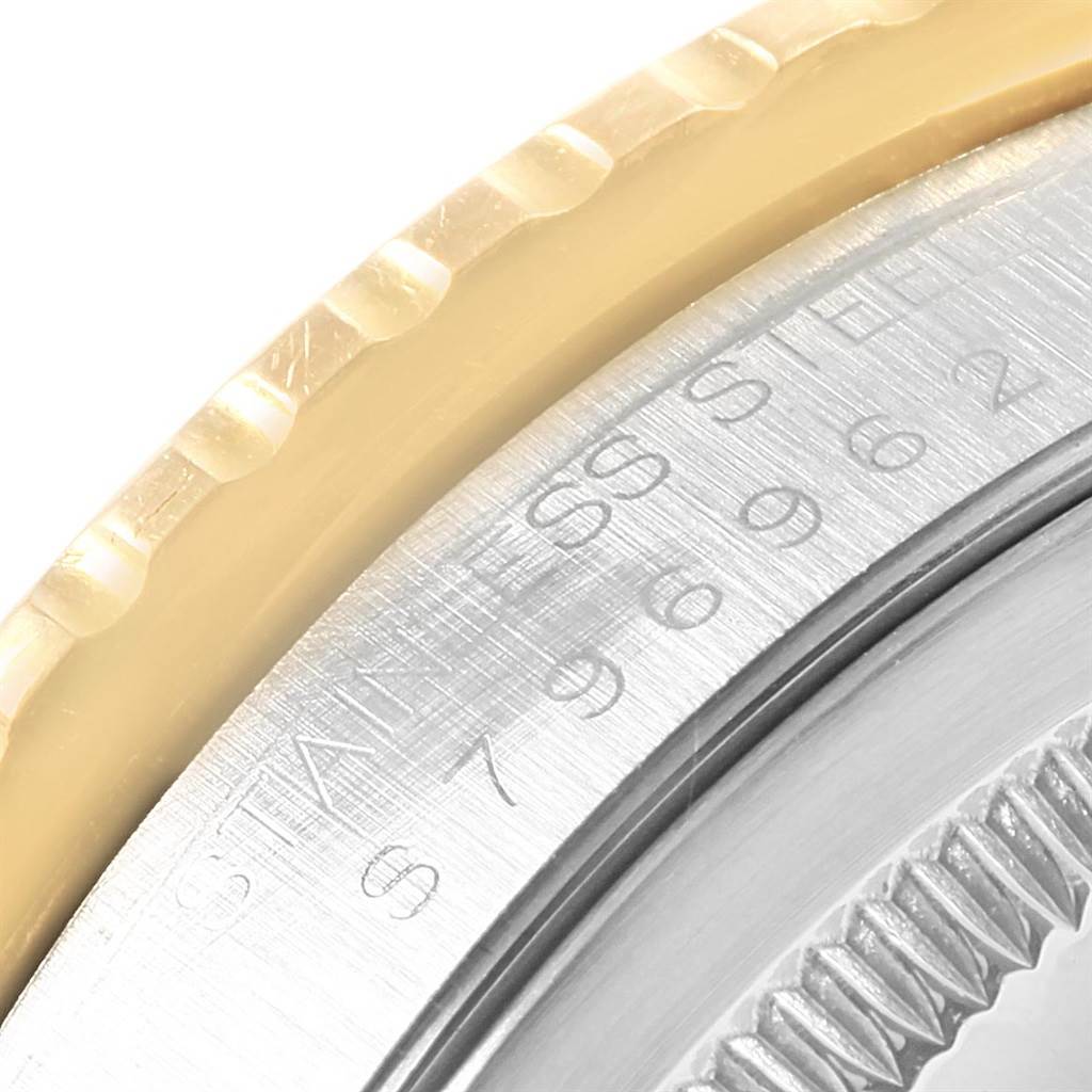 This close-up image shows part of the bezel and caseback of the Rolex Turn-o-Graph 16263 Men's Steel and Gold (two tone) White Dial 16263 Men's Steel and Gold (two tone) White Dial watch.