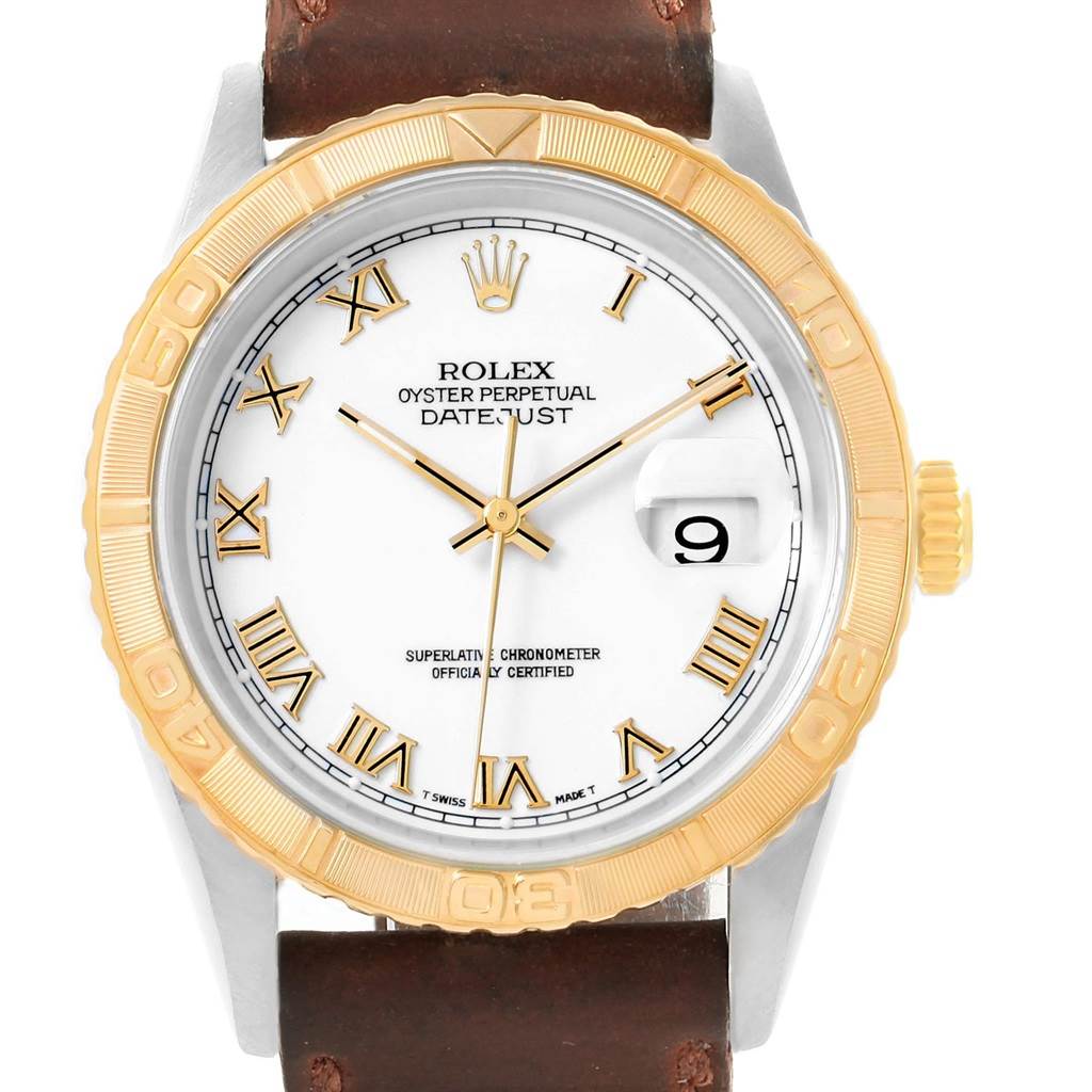 The Rolex Turn-o-Graph 16263 Men's Steel and Gold (two tone) White Dial 16263 Men's Steel and Gold (two tone) White Dial model is shown from a front angle, featuring a gold bezel, white dial with Roman numerals, and a leather strap.