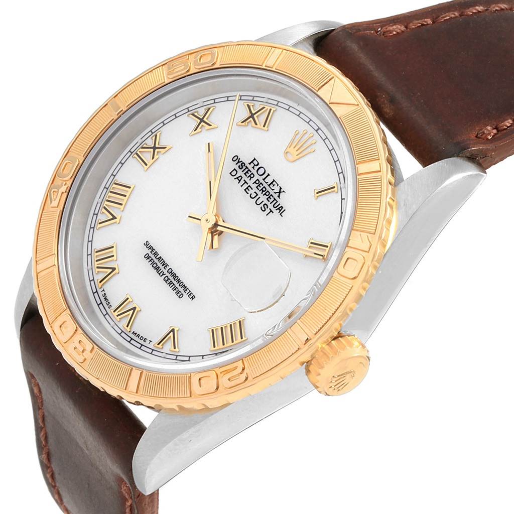 The Rolex Turn-o-Graph 16263 Men's Steel and Gold (two tone) White Dial 16263 Men's Steel and Gold (two tone) White Dial watch is shown from an angled close-up, detailing the gold bezel, white dial, and brown leather strap.