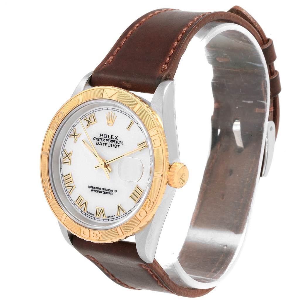 The image shows a Rolex Turn-o-Graph 16263 Men's Steel and Gold (two tone) White Dial 16263 Men's Steel and Gold (two tone) White Dial watch, front angle, featuring a gold bezel, white dial, and brown leather strap.