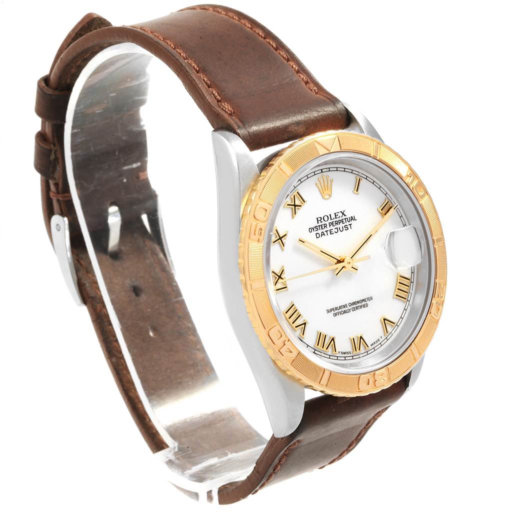 The image shows a Rolex Turn-o-Graph 16263 Men's Steel and Gold (two tone) White Dial 16263 Men's Steel and Gold (two tone) White Dial watch at an angle displaying the dial, bezel, and leather strap.