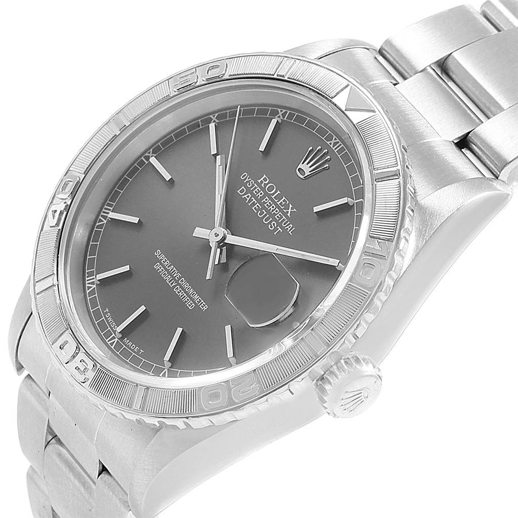 The image shows a close-up angled view of the Turn-o-Graph Rolex watch, highlighting its dial, bezel, and bracelet.