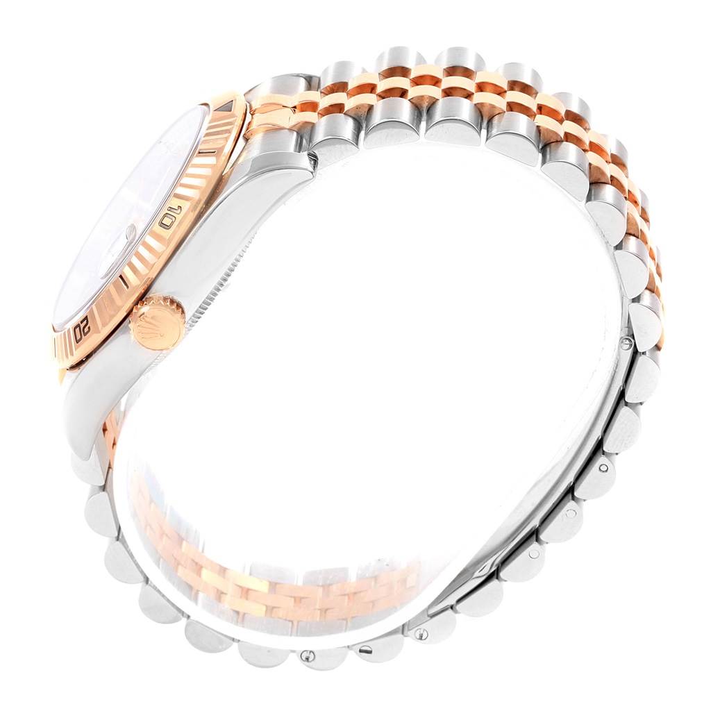 Side view of a Rolex Turn-o-Graph 116261 Men's Stainless Steel Black Dial 116261 Men's Stainless Steel Black Dial watch showing the bezel, crown, and part of the bracelet.