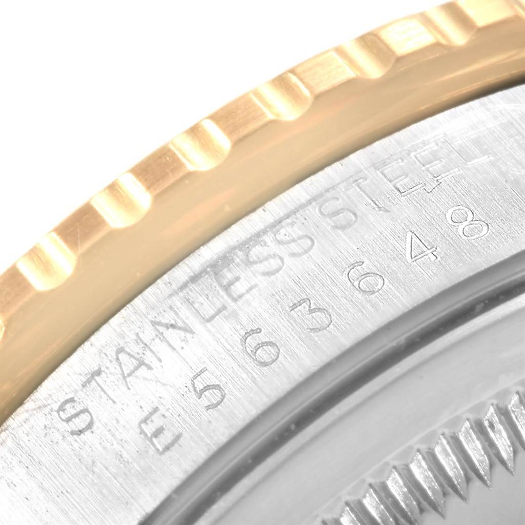 This close-up image of the Rolex Turn-o-Graph 16263 Men
s Steel and Gold (two tone) Champagne Dial 16263 Men
s Steel and Gold (two tone) Champagne Dial watch shows part of the bezel and engraved stainless steel numbers.