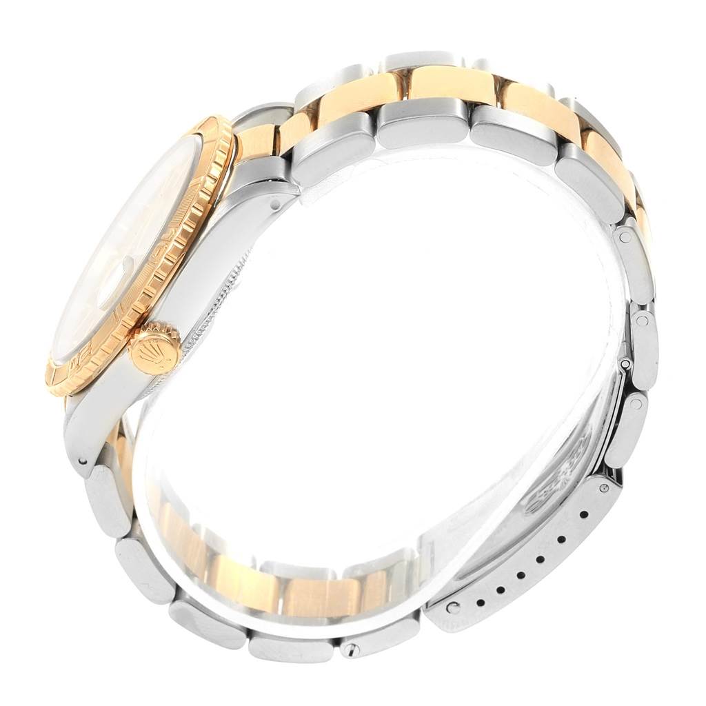 This image shows a side view of a Rolex Turn-o-Graph 16263 Men
s Steel and Gold (two tone) Champagne Dial 16263 Men
s Steel and Gold (two tone) Champagne Dial watch, highlighting its two-tone bracelet, bezel, crown, and clasp.