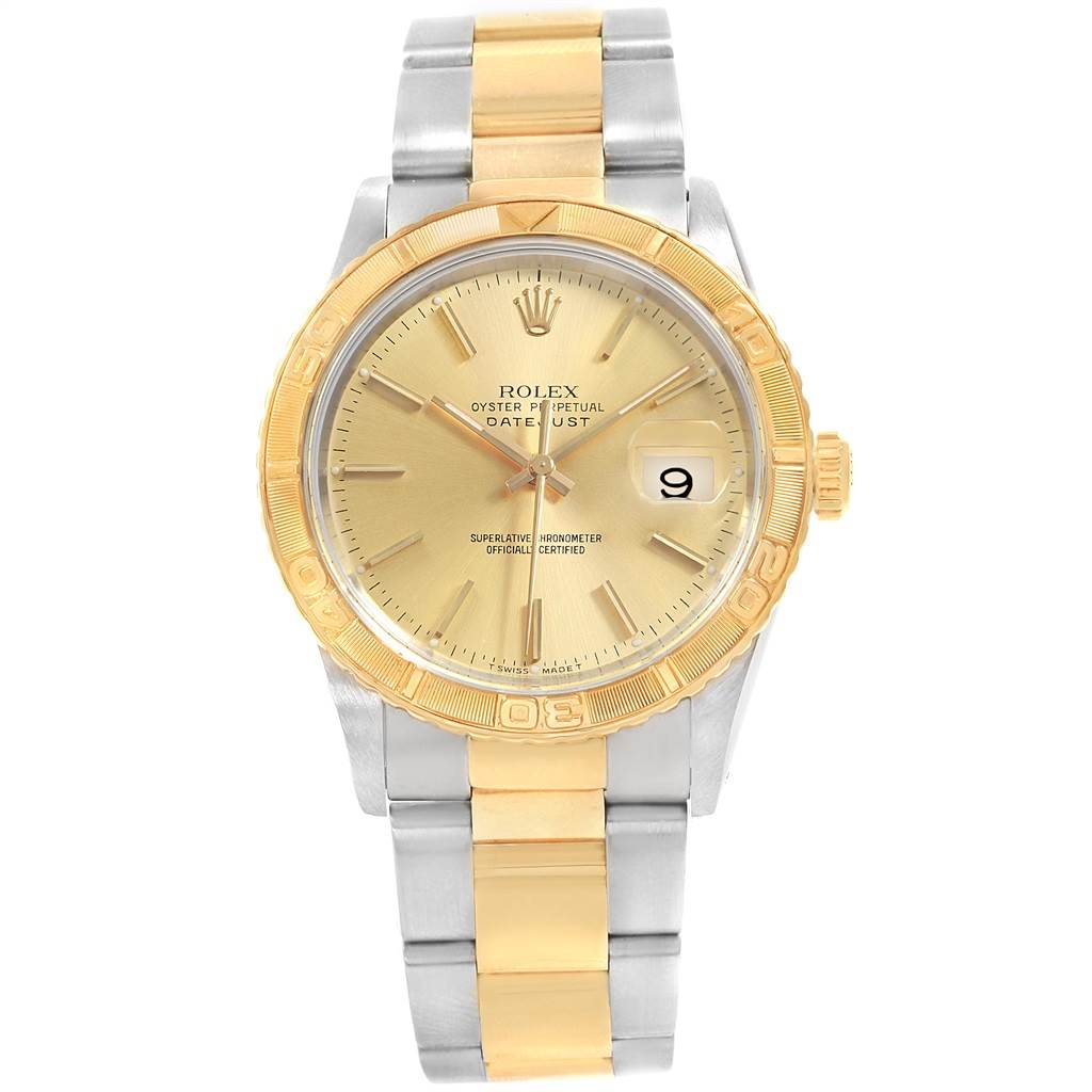 The Rolex Turn-o-Graph 16263 Men
s Steel and Gold (two tone) Champagne Dial 16263 Men
s Steel and Gold (two tone) Champagne Dial watch is shown from a top-down angle, displaying its gold and stainless steel bracelet, dial, and bezel.