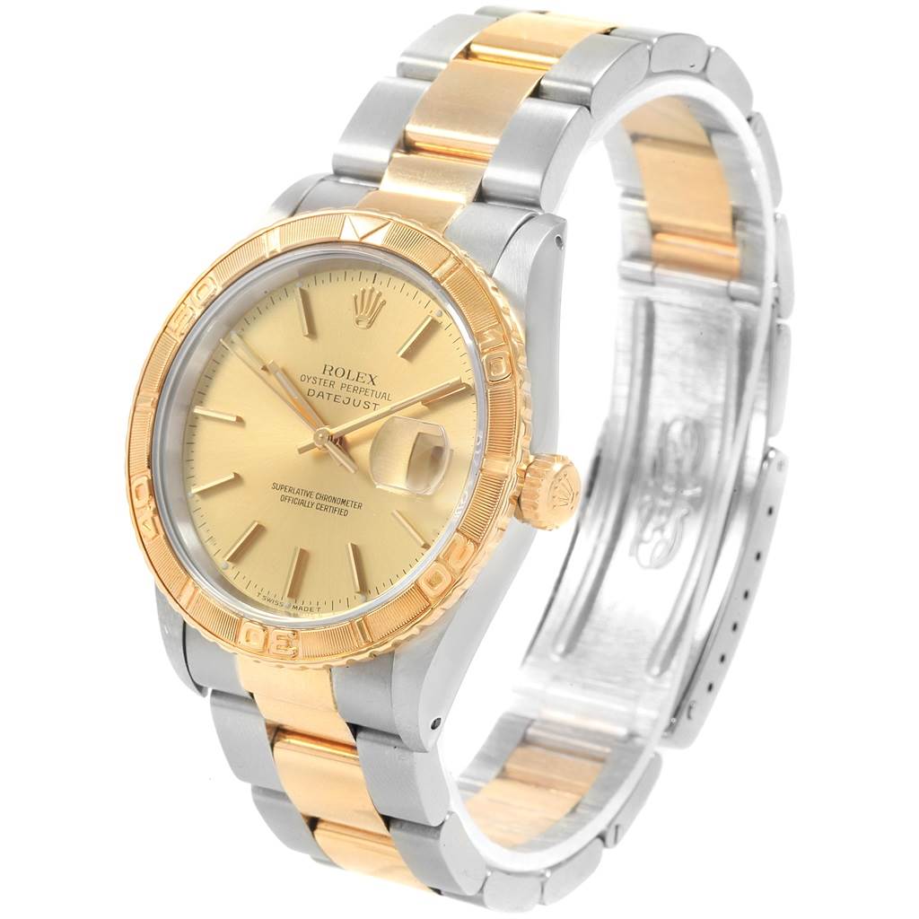 This image shows a Rolex Turn-o-Graph 16263 Men
s Steel and Gold (two tone) Champagne Dial 16263 Men
s Steel and Gold (two tone) Champagne Dial watch at a three-quarter angle, highlighting its gold bezel, dial, and two-tone bracelet.