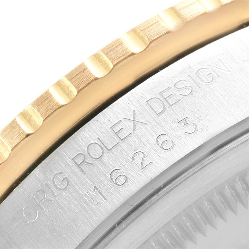 This close-up image shows part of the bezel and the engraved caseback of the Rolex Turn-o-Graph 16263 Men's Steel and Gold (two tone) Champagne Dial 16263 Men's Steel and Gold (two tone) Champagne Dial watch.