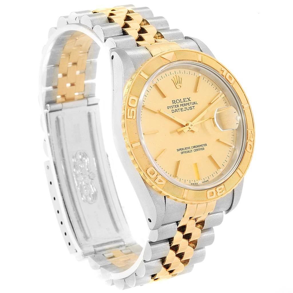 This image shows a Rolex Turn-o-Graph 16263 Men's Steel and Gold (two tone) Champagne Dial 16263 Men's Steel and Gold (two tone) Champagne Dial watch from an angled perspective, highlighting its gold bezel, dial, and two-tone metal bracelet.
