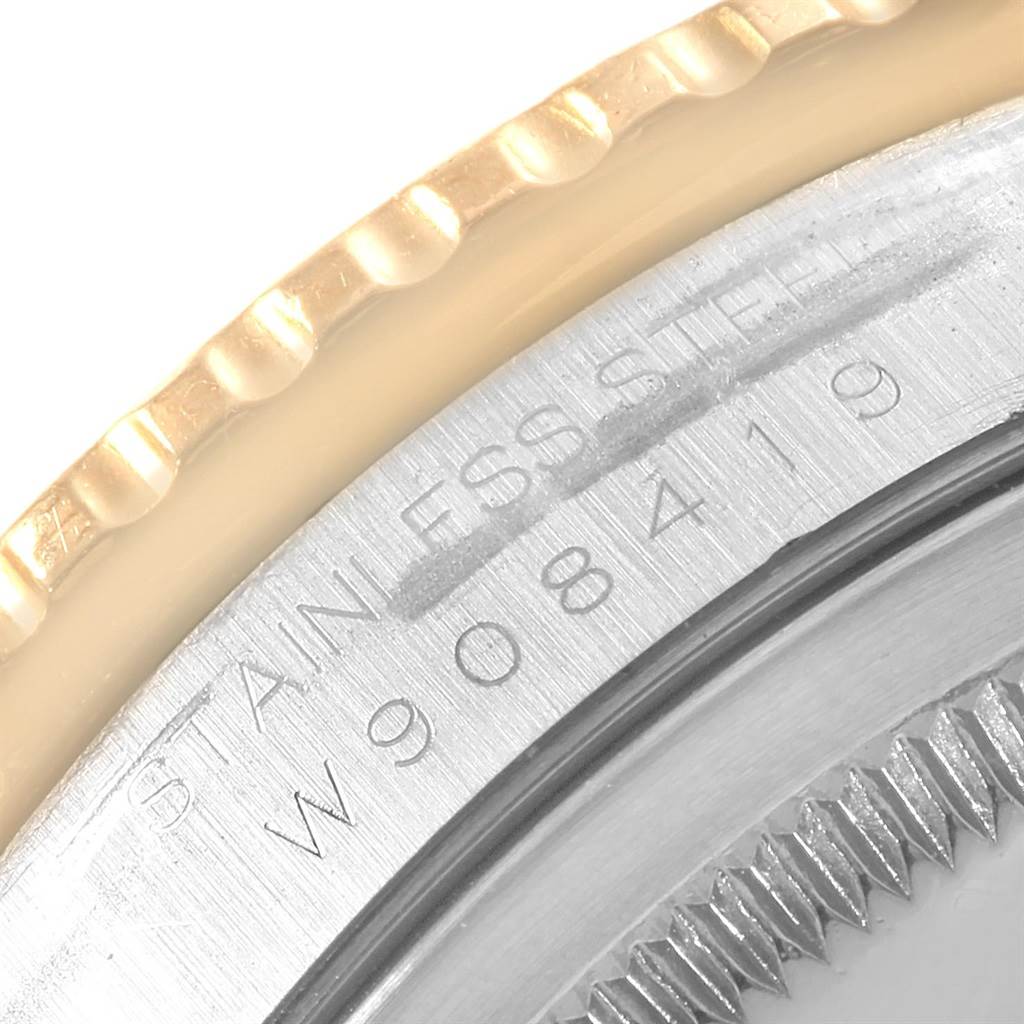 This is a close-up angle of the bezel and edge of the case of a Rolex Turn-o-Graph 16263 Men's Steel and Gold (two tone) Grey Dial 16263 Men's Steel and Gold (two tone) Grey Dial watch, showing part of the engraving.