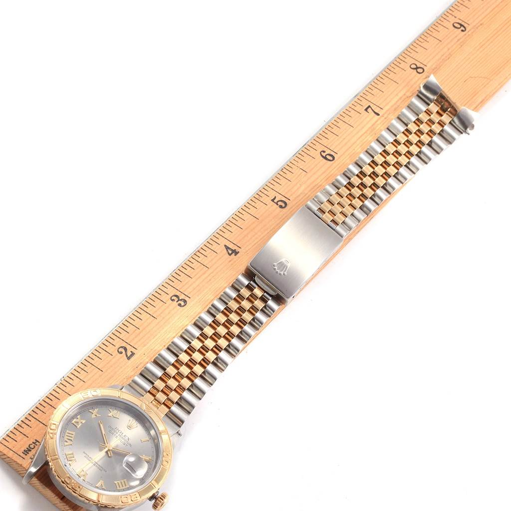 The image shows a Rolex Turn-o-Graph 16263 Men's Steel and Gold (two tone) Grey Dial 16263 Men's Steel and Gold (two tone) Grey Dial watch from an overhead angle with a ruler for scale.