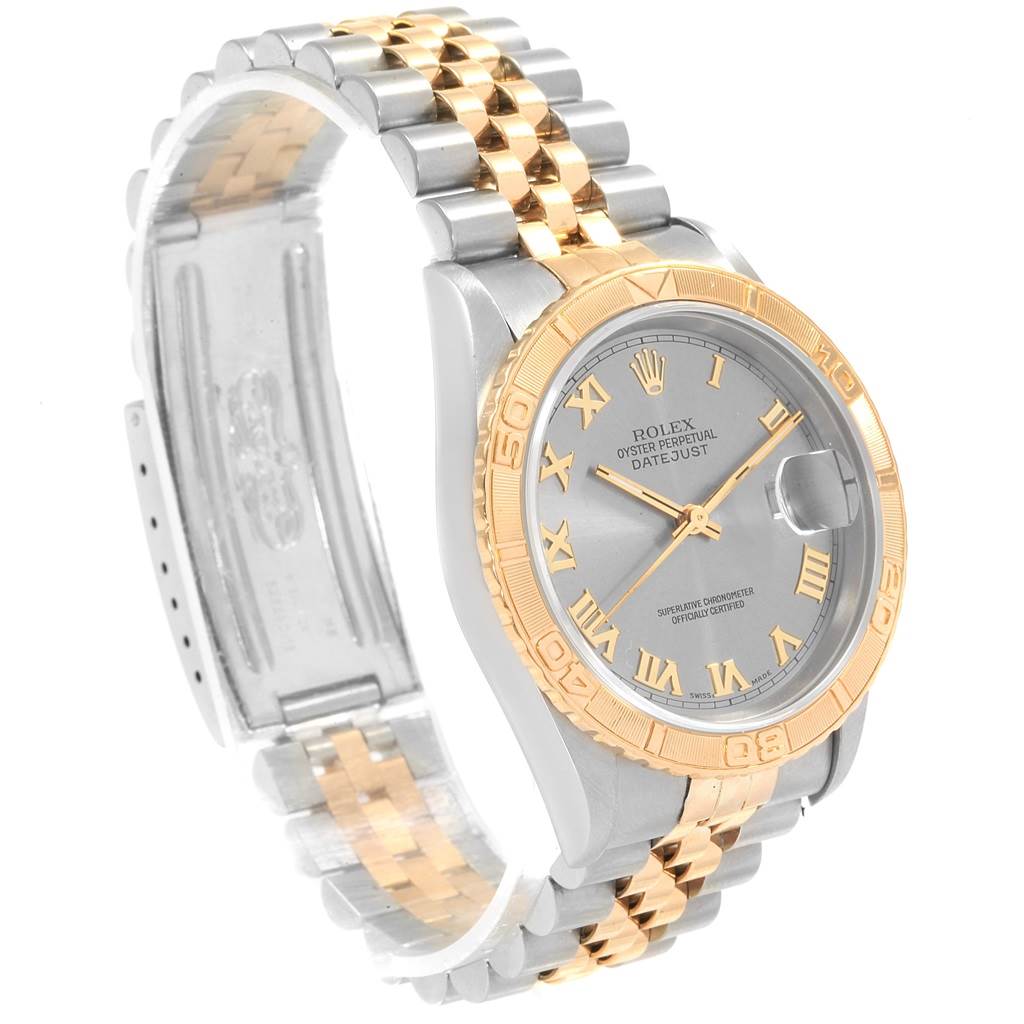 The Rolex Turn-o-Graph 16263 Men's Steel and Gold (two tone) Grey Dial 16263 Men's Steel and Gold (two tone) Grey Dial watch is shown at a tilted angle, displaying the face, bezel, and part of the metal link bracelet.