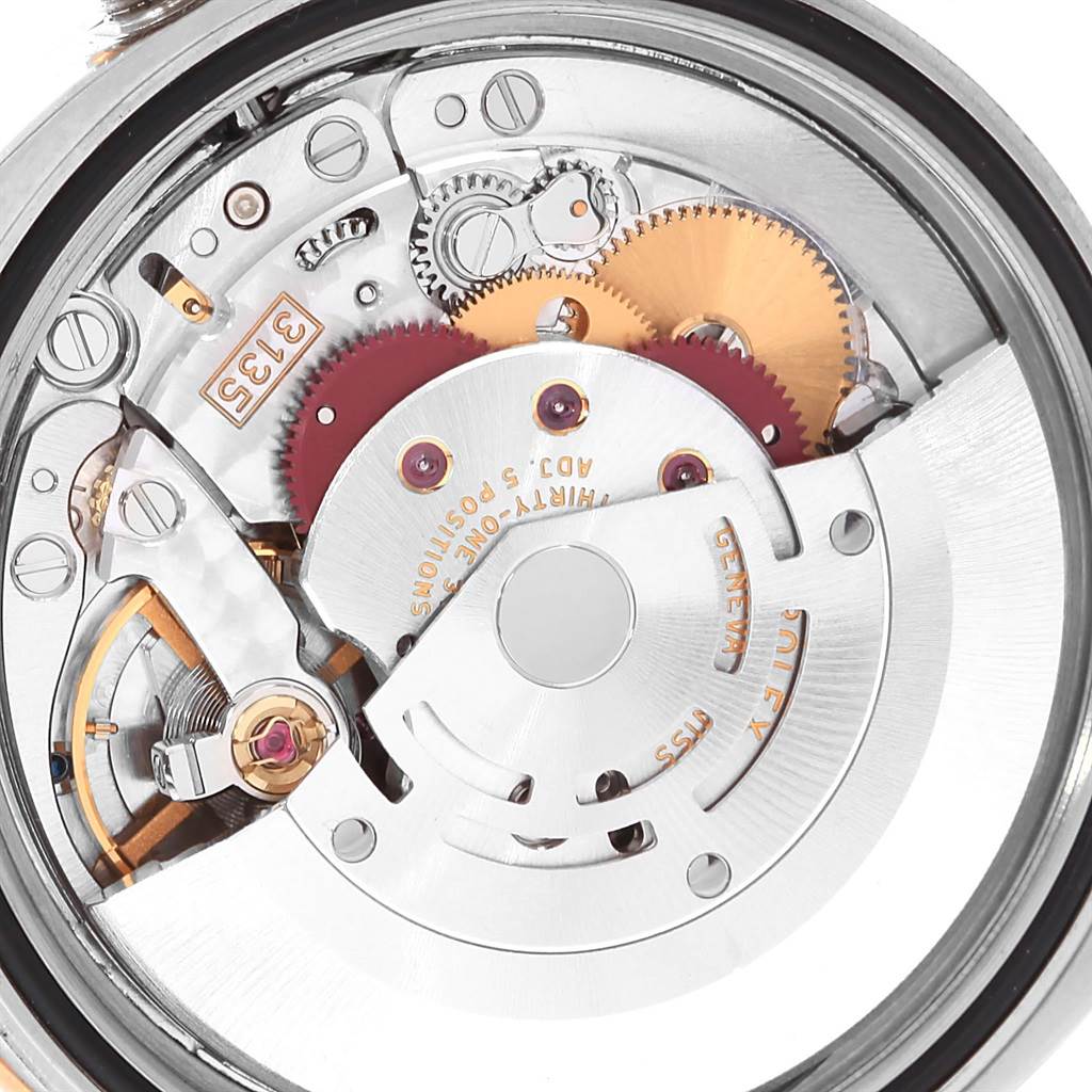 The image shows a close-up view of the movement mechanism of the Rolex Turn-o-Graph 116261 Men
s Stainless Steel White Dial 116261 Men
s Stainless Steel White Dial watch.