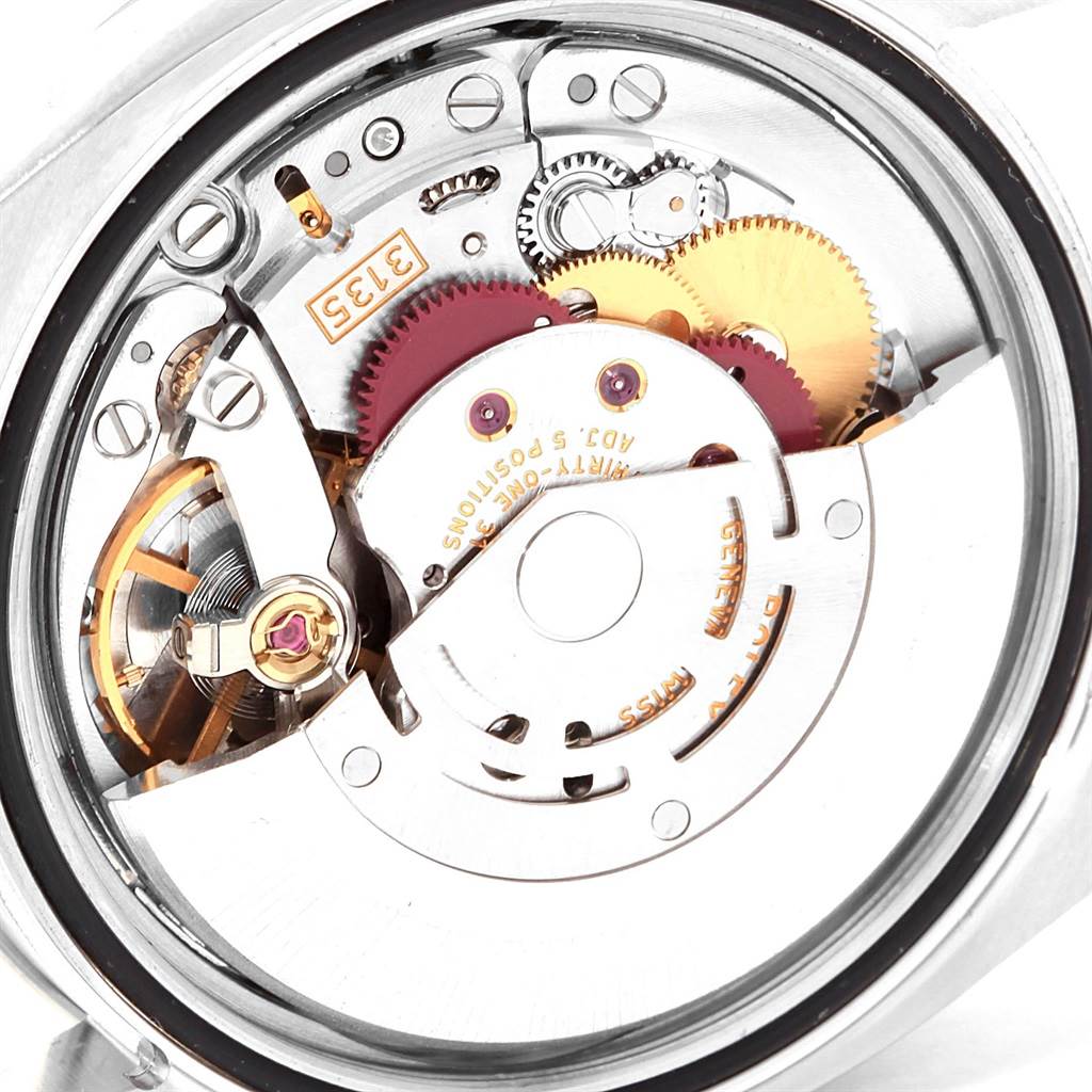 This image shows a close-up of the Rolex Turn-o-Graph 116264 Men
s Stainless Steel Black Dial 116264 Men
s Stainless Steel Black Dial watch movement and internal gears from the back.