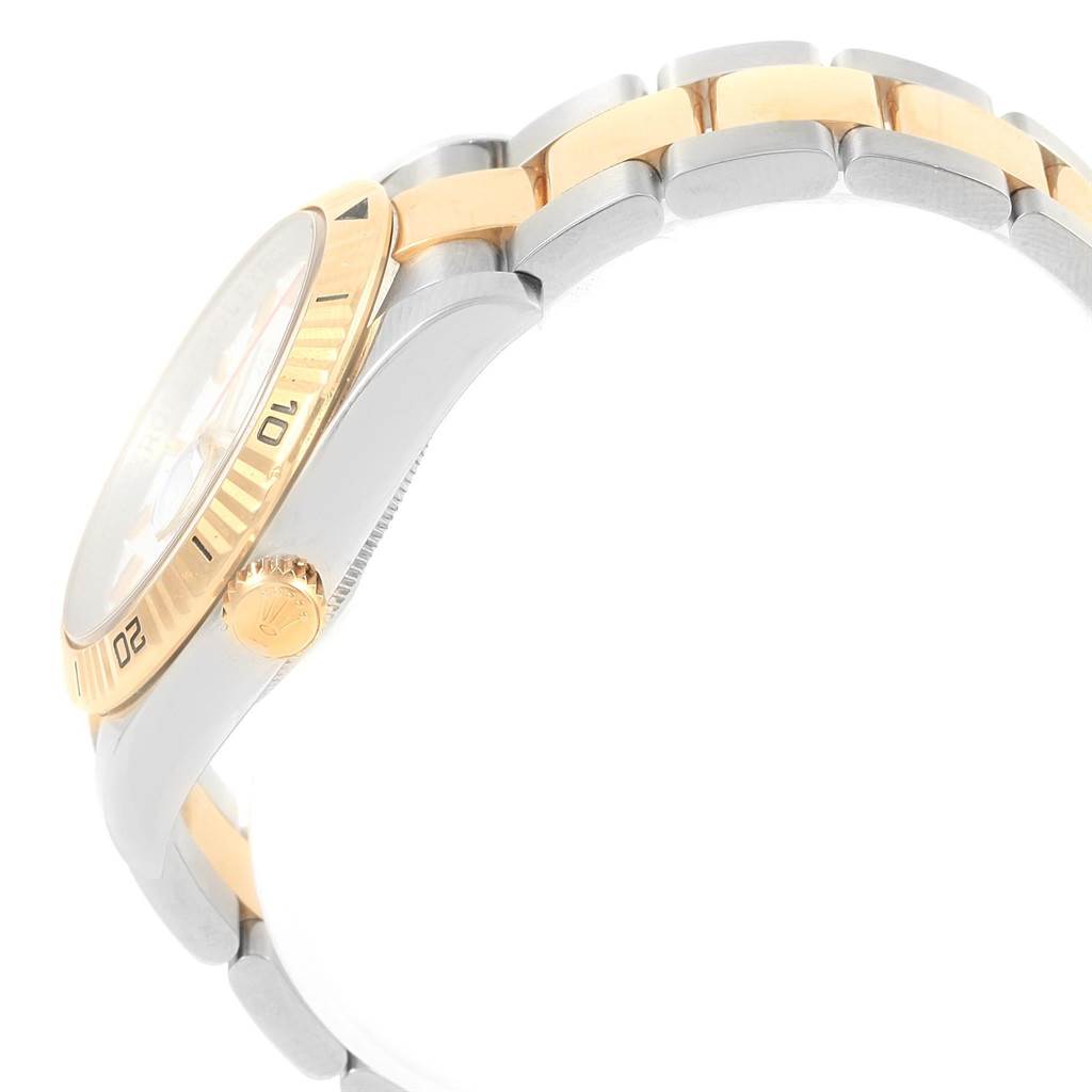 The image shows a side view of a Rolex Turn-o-Graph 116263 Men's Stainless Steel White Dial 116263 Men's Stainless Steel White Dial watch, highlighting its bezel, crown, and part of the bracelet.