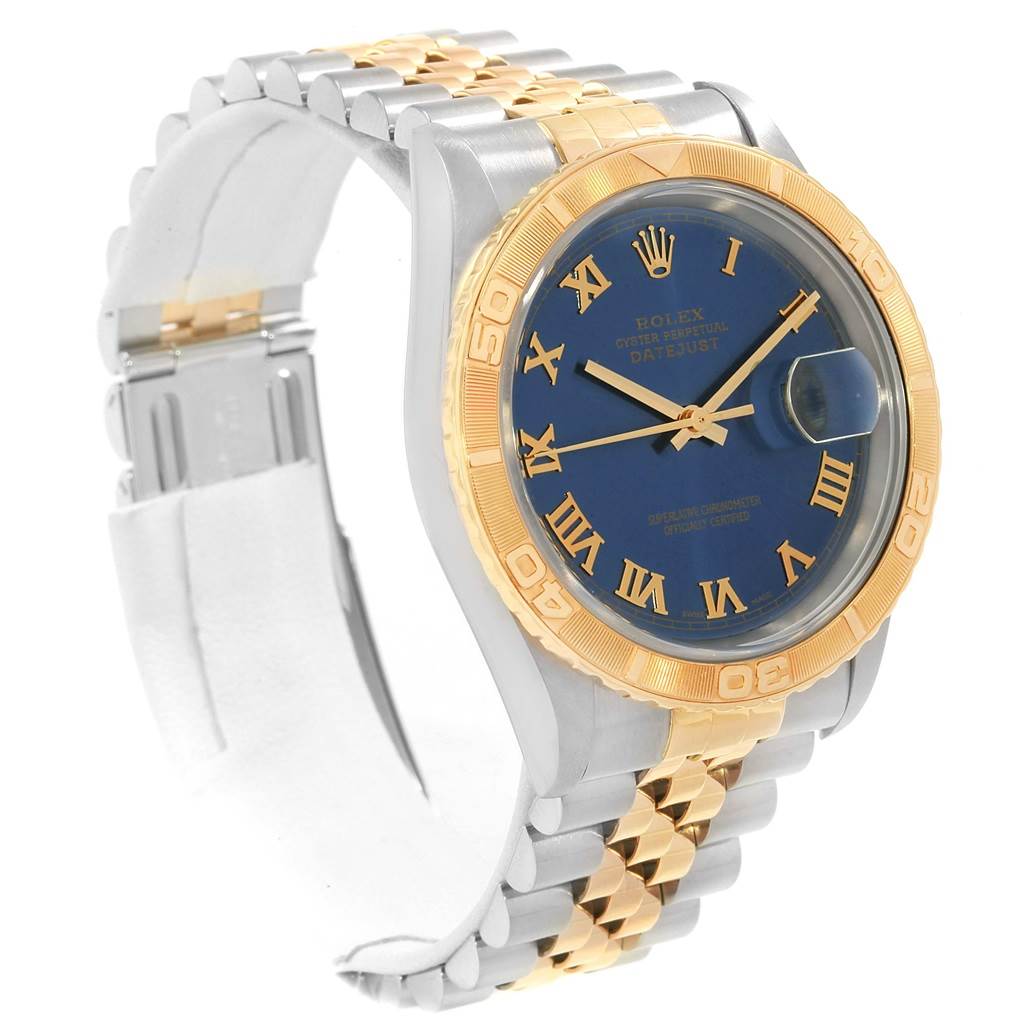 This Rolex Turn-o-Graph 16263 Men's Steel and Gold (two tone) Blue Dial 16263 Men's Steel and Gold (two tone) Blue Dial model is shown at a slight angle, featuring its two-tone metal bracelet, blue dial, and gold bezel.